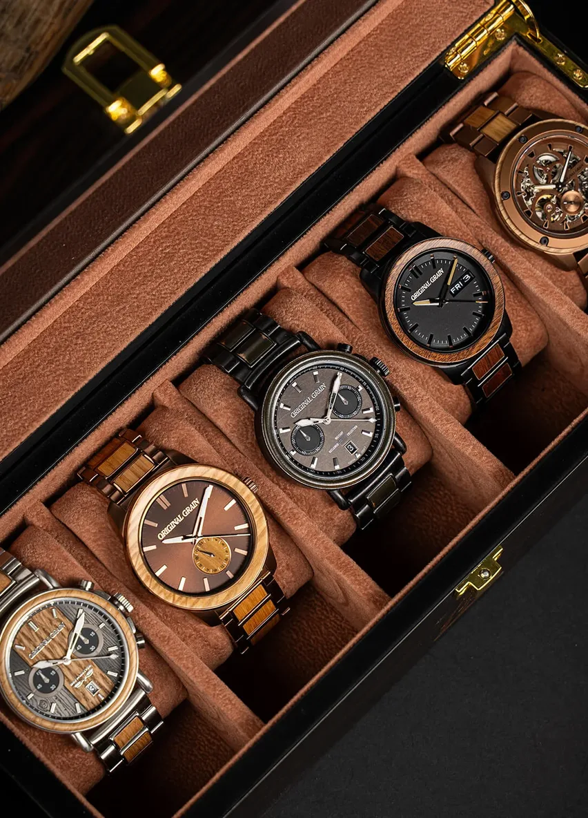A row of Original Grain wood and steel watches in an open display case