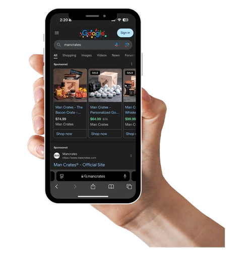 A hand holding a phone showing Google Shopping results